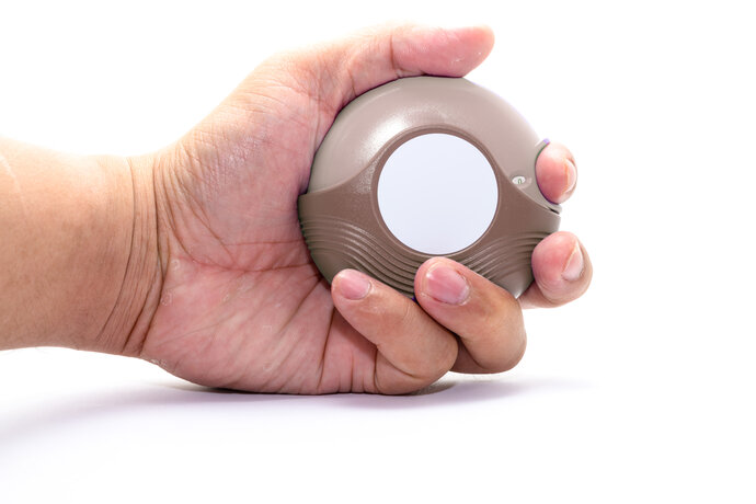 Hand holding inhaler isolated white background